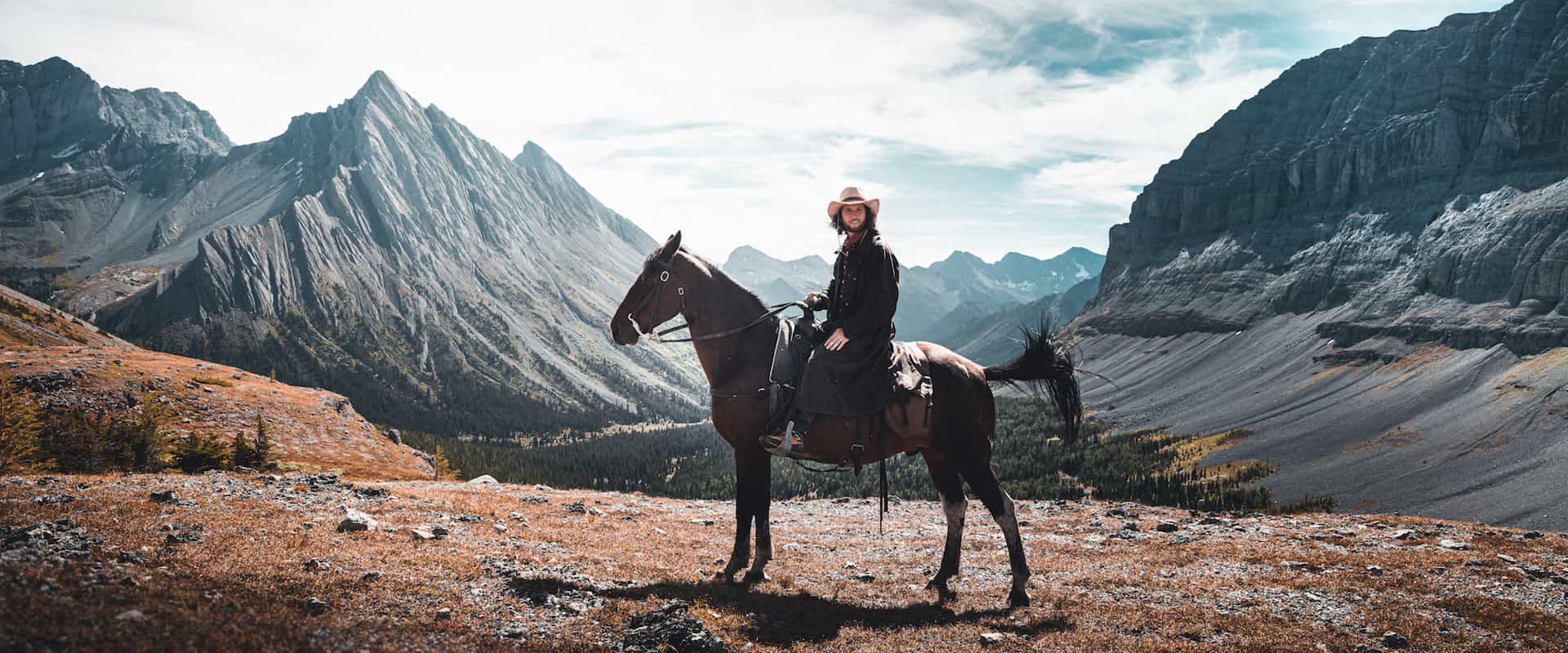 Ride to the summit at Allenby Pass with Banff Trail Riders in the Canadian Rockies