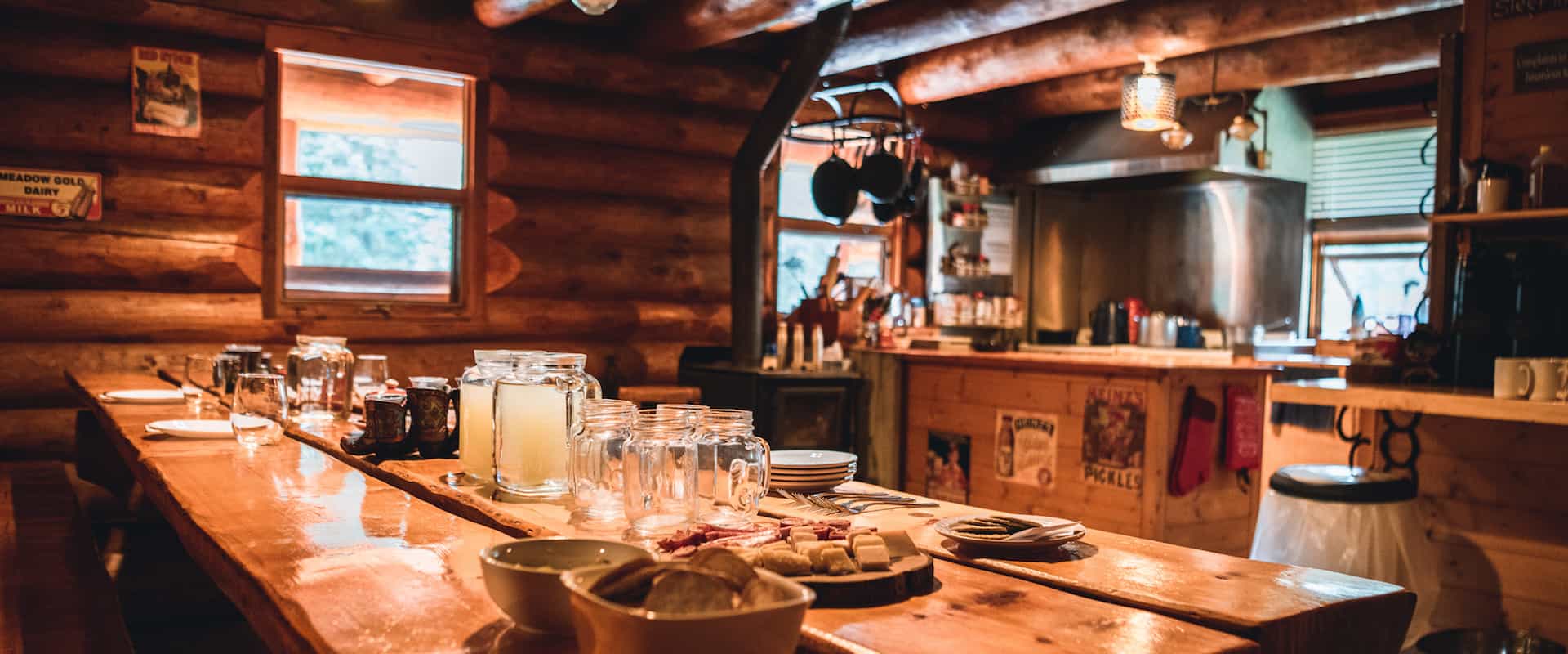 Dine at the large kitchen table at cozy Sundance Lodge